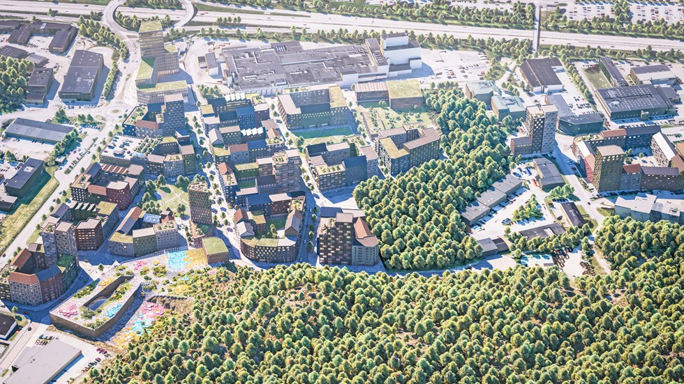 Vision från fågelperspektiv över Södra Änggården, där mycket skog och träd syns i anslutning till bostadsområden.